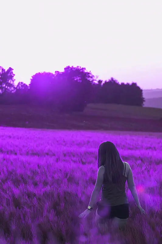 Woman walking in a field of abundance