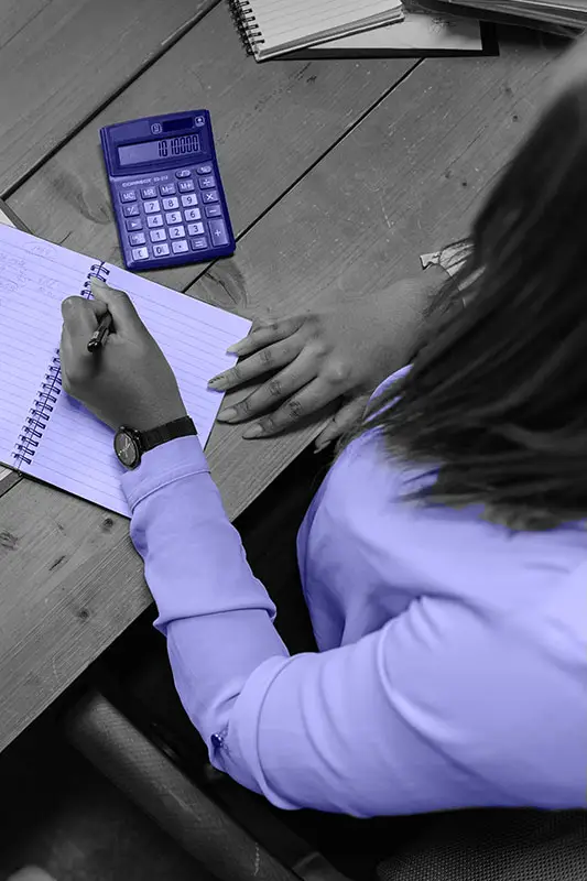 Woman calculating her expenses and income