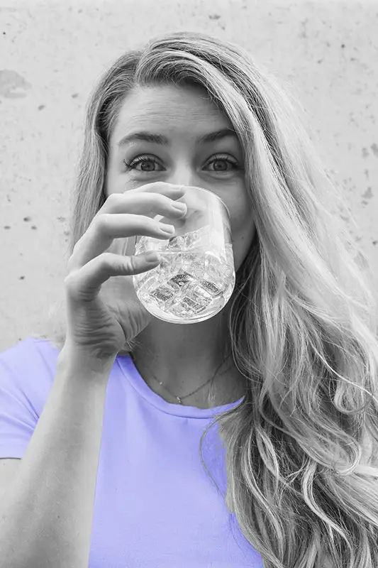 Woman drinking glass of water. Drinking water will improve your health