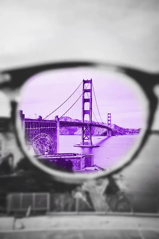 Glasses focussing on a bridge, create a mental image to attract what you want through the law of attraction