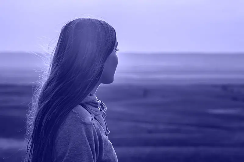 woman being present while looking at a beautiful, wide view